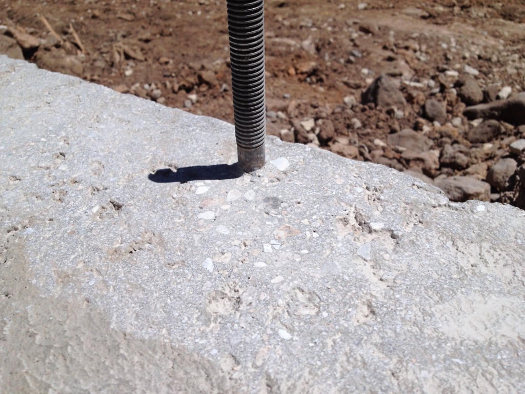 Frost wall smoothed out with angle grinder, to form a more air tight seal with building gasket.